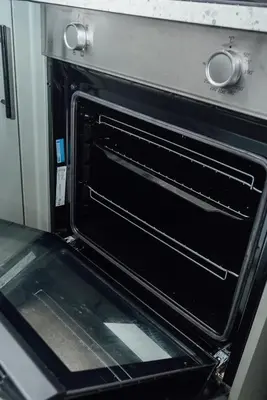 an oven with its door open in a kitchen at Stylish 3 Bed Home with 4 beds- 5 Min walk From Anfield Stadium in Liverpool