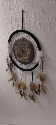 a cat is sleeping in a dream catcher on a ceiling at The Dreamcatcher Hotel in Blackpool
