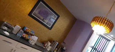 a kitchen with a picture hanging on the wall at The Dreamcatcher Hotel in Blackpool