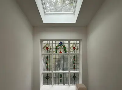 a glass window in a room with a skylight at Sarah's Woodland Liverpool Stays in Waterloo