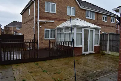 a house with a greenhouse on the front of it at Liverpool Redwood house in Liverpool