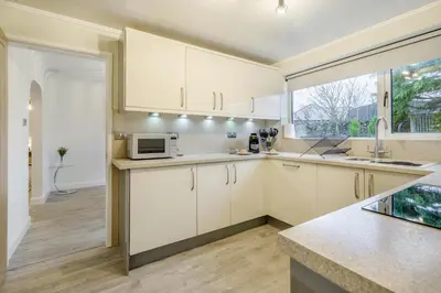 a kitchen with white cabinets and a microwave at 3 Bed in Baycliff oc-b34152 in Baycliff