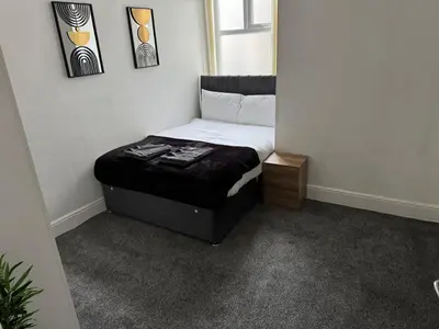 a small bedroom with a bed in a room at 1BR Apartment in Blackpool l Sleeps 4, Fully Furnished in Blackpool