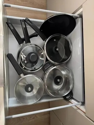 a group of pots and pans in a drawer at Livs cozy corner in Crossens