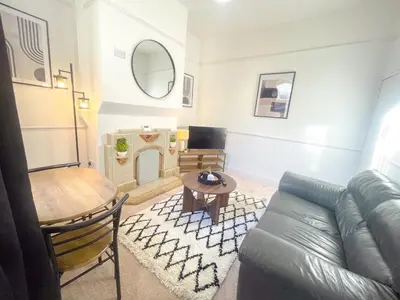 a living room with a couch and a table at Three Bedroom House by Brookland Stays Serviced Accommodation & Short Lets in Preston with Free WiFi in Preston