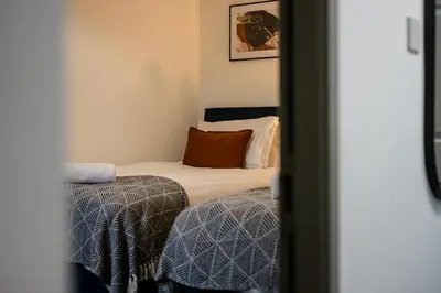 a small bedroom with a bed and a pillow at Earle House - Air Host & Stay - 5 BR - Sleeps 13 in Liverpool