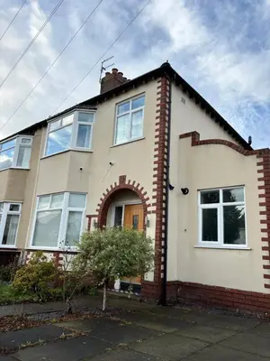 a white house with a red brick at Stanley Suite in Liverpool