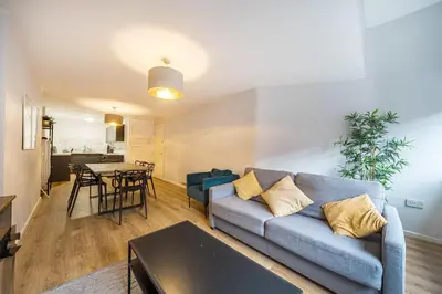 a living room with a couch and a table at Host & Stay - Stanley Street Apartments in Liverpool