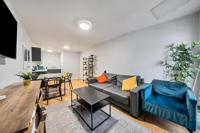 a living room with a couch and a table at Host & Stay - Stanley Street Apartments in Liverpool