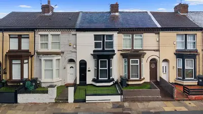 a group of houses in a row at Bibbys in Litherland