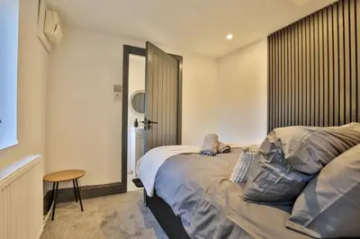 a bedroom with a bed and a table and a window at Chesterfield House, Blackpool, Free Parking in Blackpool