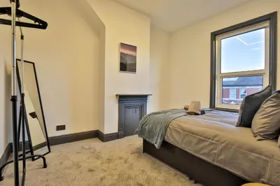 a bedroom with a bed and a window at Chesterfield House, Blackpool, Free Parking in Blackpool