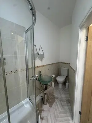 a bathroom with a shower and a sink and a toilet at Spacious 2 bed Apt Liverpool City Centre in Liverpool