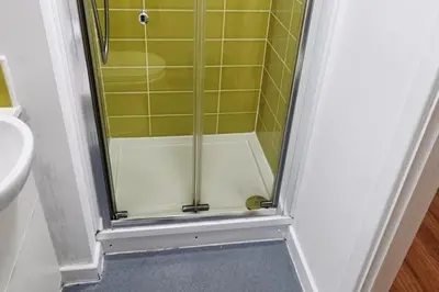 a shower with a glass door in a bathroom at Central Liverpool 1-Bed Apartment City Centre in Liverpool