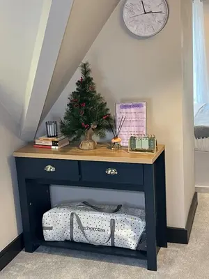 a table with a christmas tree on top of it at 2BR Cosy Wallasey Stay Near Liverpool WiFi Parking in Wallasey
