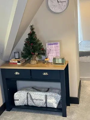 a table with a christmas tree on top of it at 2BR Cosy Wallasey Stay Near Liverpool WiFi Parking in Wallasey