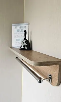 a wooden shelf on a door with a figurine on it at Willerby Seasons in Morecambe