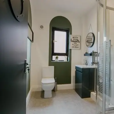 a bathroom with a toilet and a sink at Cosy New Brighton Room for Rent in New Brighton