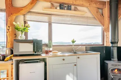 a kitchen with a microwave and a sink and a window at 1 Bed in Newton In Bowland oc-h34064 in Newton
