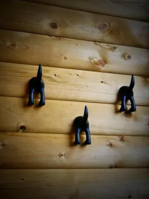 three toy animals hanging on a wooden wall at The Ferny Hoolet in Caton