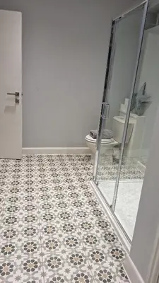 a bathroom with a toilet and a mirror at Victorian Suites Apartment in Southport