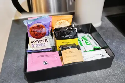a black box filled with different types of snacks at Central Liverpool Baltic Apartment Sleeps 7 in Liverpool