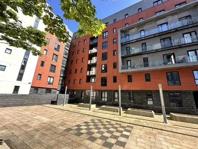 two tall buildings with a checker board in front of them at Central Liverpool Baltic Apartment Sleeps 7 in Liverpool