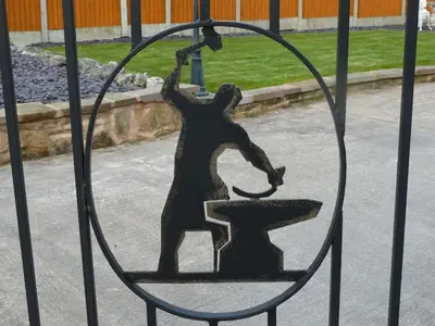 a statue of a bear on a gate at Smithy lodge guest house in Leyland