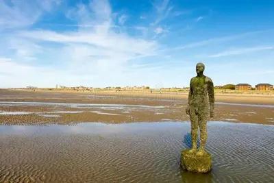 a statue of a man standing in the water at #94 Lux Crosby Gardens Apartment 2 beds 2 baths in Waterloo