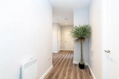 a hallway with a vase with a plant in it at #94 Lux Crosby Gardens Apartment 2 beds 2 baths in Waterloo