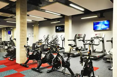 a gym with a bunch of exercise bikes at For Students Only Cozy Stays at Crosshall Street in Liverpool