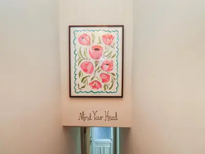 a picture of flowers hanging on a wall at Levenside in Preston