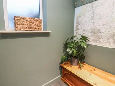 a room with a bench and a map on the wall at Levenside in Preston