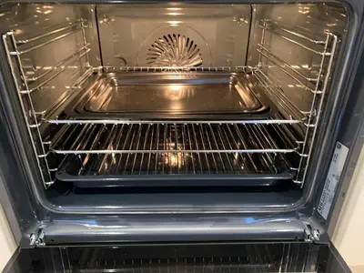 an oven with its door open with a fan at Newly renovated countryside retreat in Scorton in Scorton