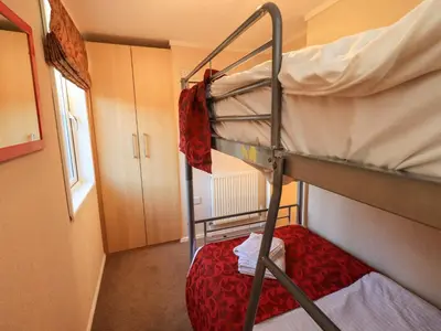 a bedroom with two bunk beds in a room at Kingfisher Lodge - Arnside 14 in Carnforth