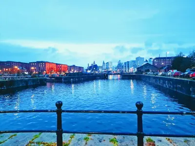 a view of a river with a city in the background at 5 star Luxury Apartment in City Centre with views in Liverpool