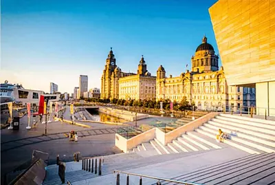 a large building with stairs in front of it at 5 star Luxury Apartment in City Centre with views in Liverpool