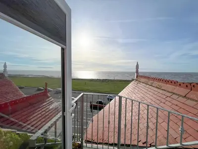 a view of the ocean from the balcony of a house at St Annes Beach Apartments in Lytham St Annes