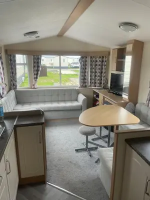 a living room with a couch and a table at Gemini in Heysham