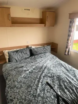 a bedroom with a bed in a small room at Gemini in Heysham