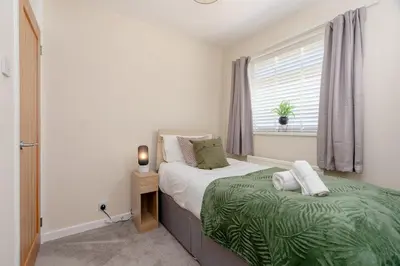 a bedroom with a bed and a window at Moorland Bungalow Central Clitheroe in Clitheroe