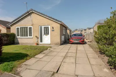 a car parked in front of a house at Moorland Bungalow Central Clitheroe in Clitheroe