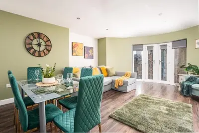 a living room with a table and a couch at L1 City Centre Stay! Nightlife, Close to everything! Carpark on street! in Liverpool