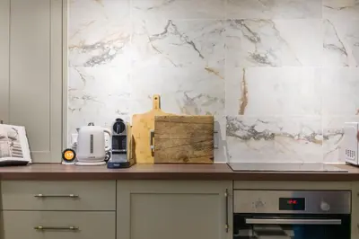 a kitchen with a counter top with a coffee maker at Liverpool Georgian Townhouse for Family & Groups in Liverpool