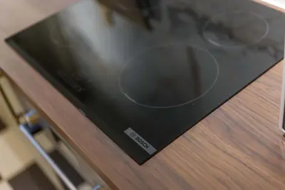 a microwave oven sitting on top of a wooden table at Liverpool Georgian Townhouse for Family & Groups in Liverpool