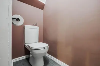 a bathroom with a white toilet in a room at Premium 4bedroom City Home Close to LFC in Liverpool