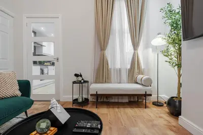 a living room with a couch and a chair at Premium 4bedroom City Home Close to LFC in Liverpool