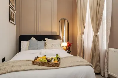 a basket of fruit sitting on top of a bed at Premium 4bedroom City Home Close to LFC in Liverpool