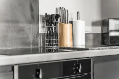 a kitchen counter with utensils on a counter top at Ideal for Getaways Liverpool Flat, sleeps 4 in Liverpool