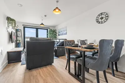 a dining room with a table and chairs at Ideal for Getaways Liverpool Flat, sleeps 4 in Liverpool